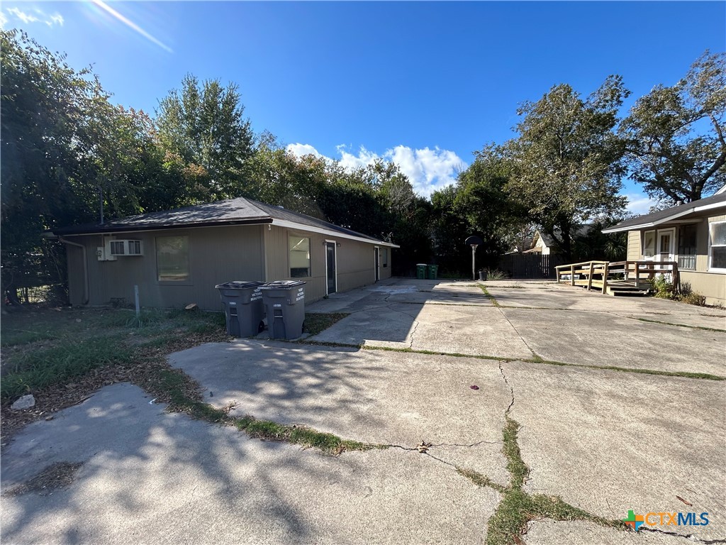1511 East Constitution Street Victoria, TX 77901 - Photo 12 of 26 a view of backyard of house with green space