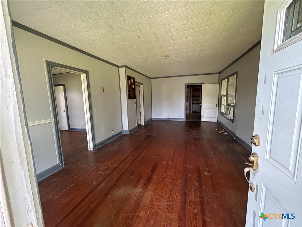 1511 East Constitution Street Victoria, TX 77901 - Photo 15 of 26 a view of a hallway with wooden floor