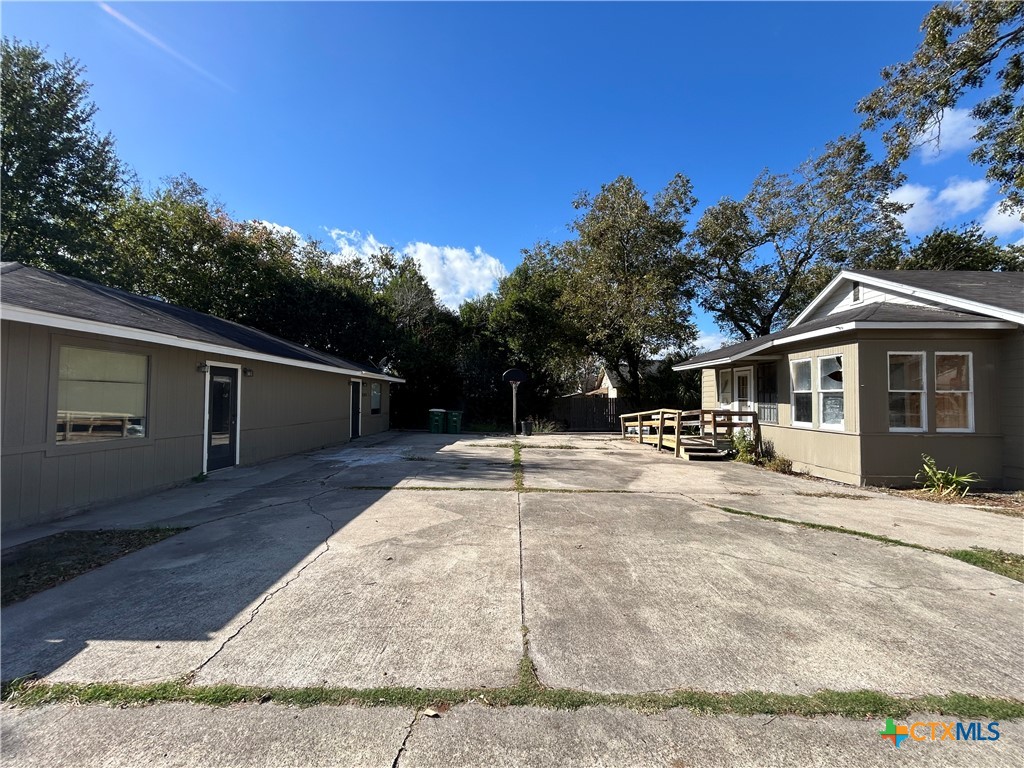 1511 East Constitution Street Victoria, TX 77901 - Photo 10 of 26 a view of a house with backyard and sitting area