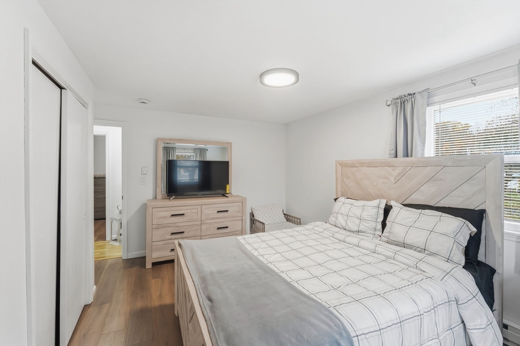 26 Wakefield Avenue Webster, MA 01570 - Photo 17 of 42 a bedroom with a bed and a flat screen tv