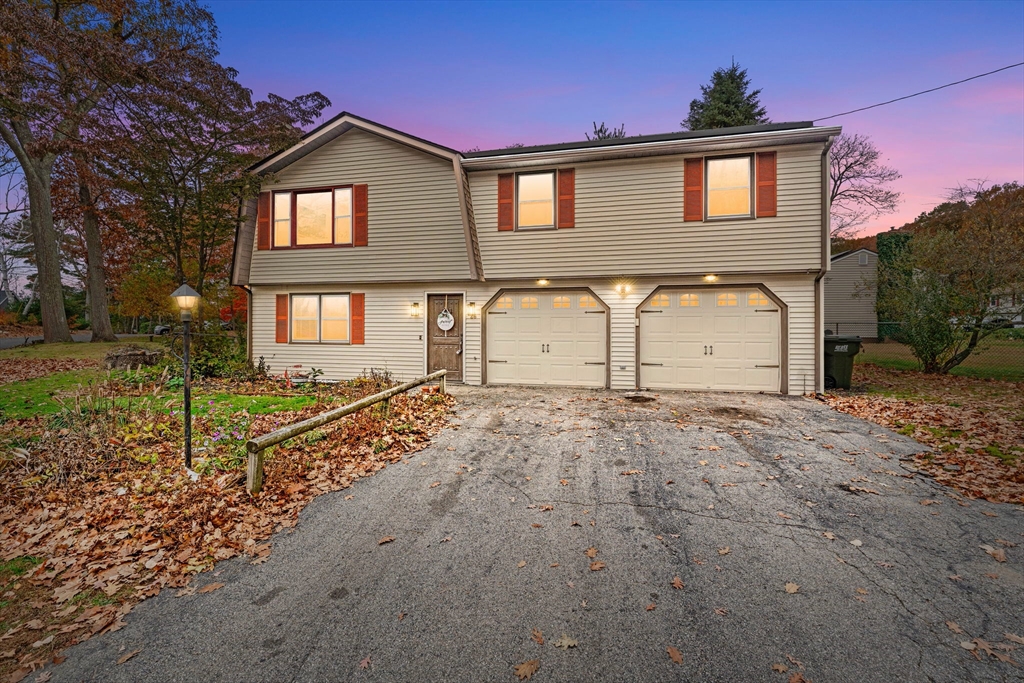 26 Wakefield Avenue Webster, MA 01570 - Photo 2 of 42 a front view of a house with a yard and garage