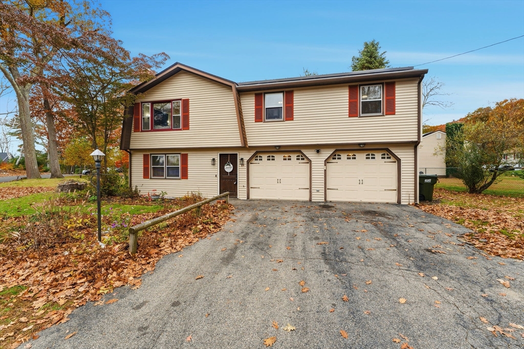 26 Wakefield Avenue Webster, MA 01570 - Photo 32 of 42 front view of a house with a yard