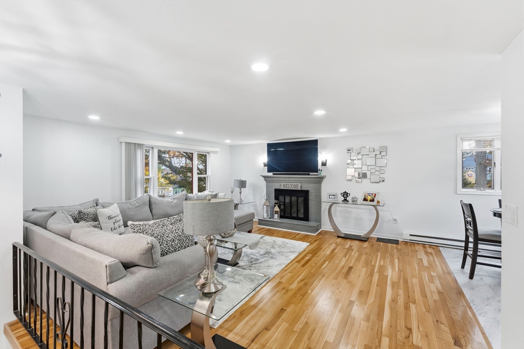 26 Wakefield Avenue Webster, MA 01570 - Photo 7 of 42 a living room with furniture and a fireplace