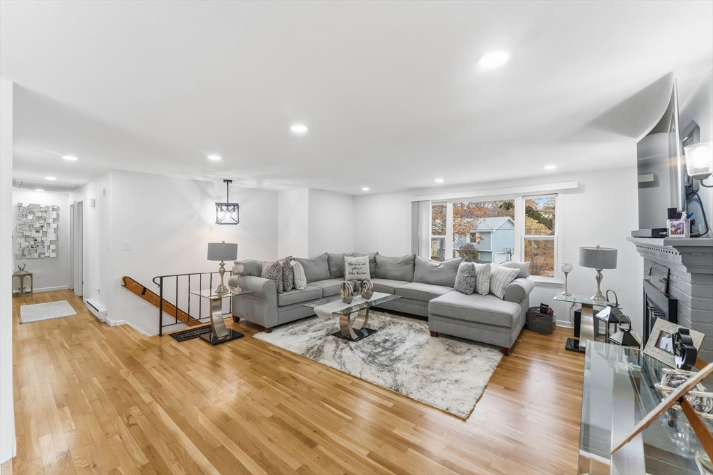 26 Wakefield Avenue Webster, MA 01570 - Photo 9 of 42 a living room with furniture wooden floor and a view of kitchen