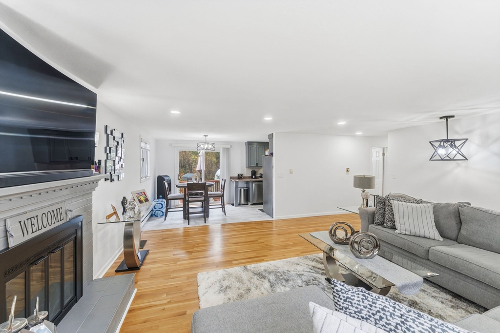 26 Wakefield Avenue Webster, MA 01570 - Photo 10 of 42 a living room with fireplace furniture and a flat screen tv