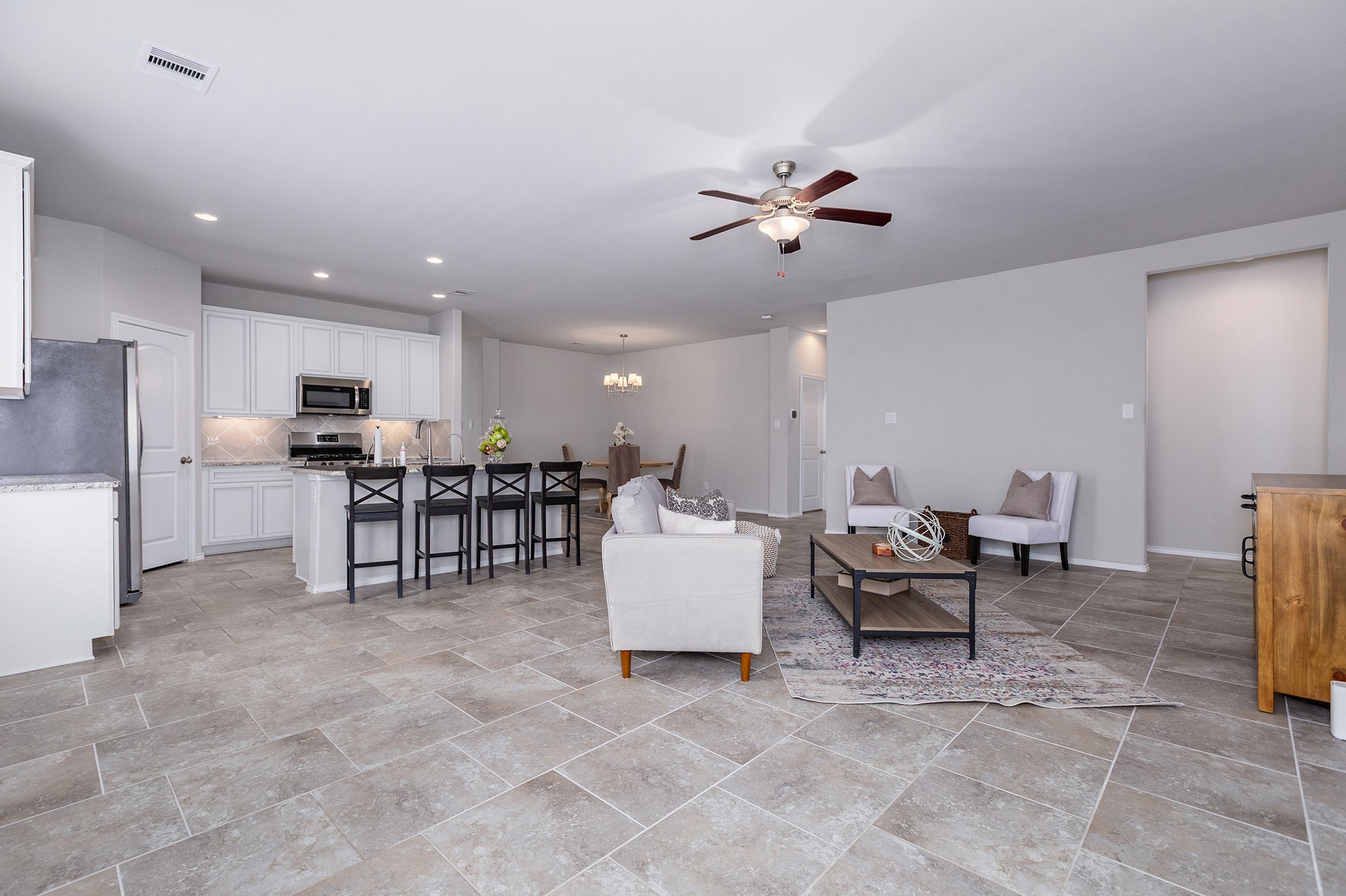 5611 Claymore Meadow Lane Spring, TX 77389 - Photo 12 of 32 a living room with furniture and kitchen view