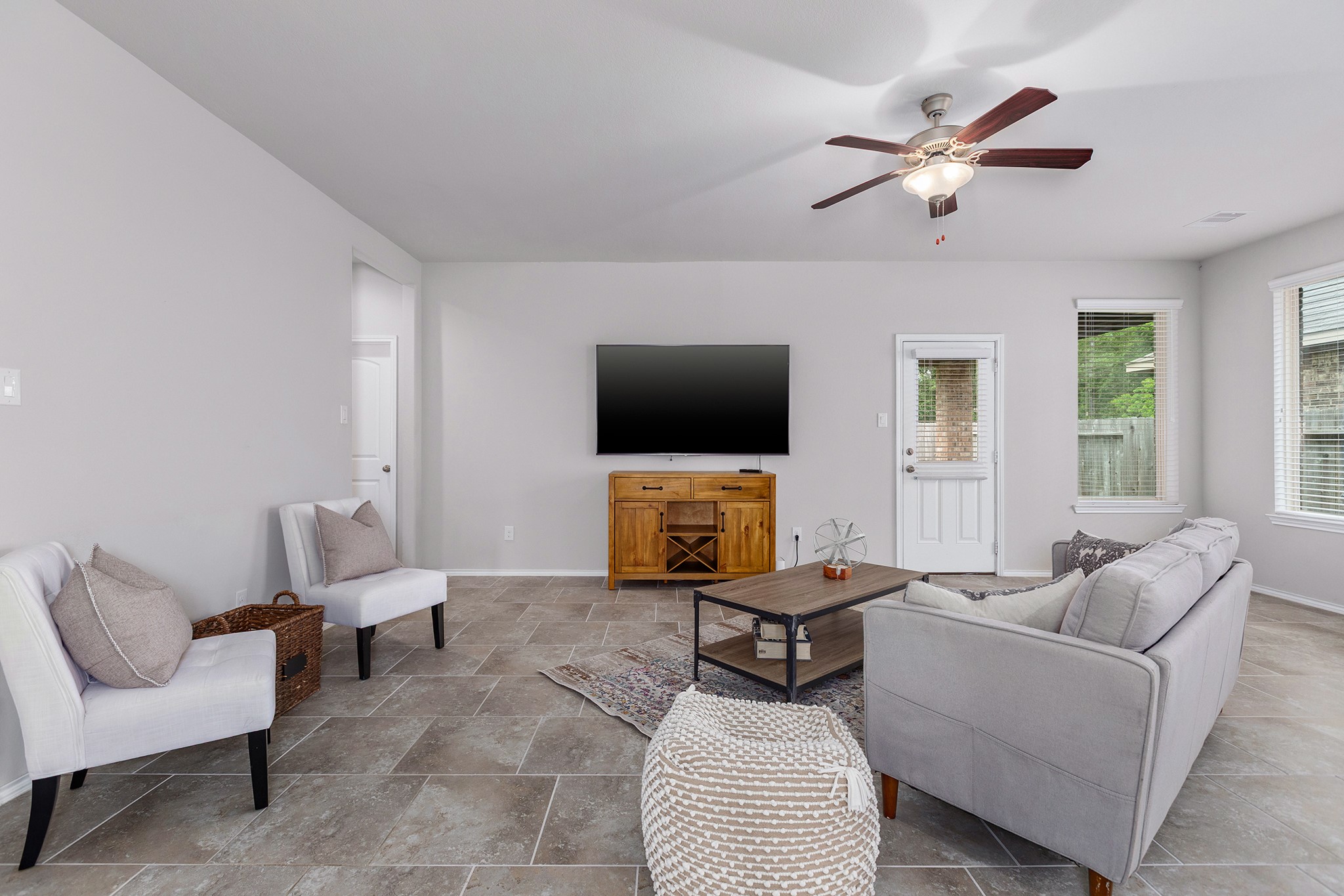 5611 Claymore Meadow Lane Spring, TX 77389 - Photo 13 of 32 a living room with furniture and a flat screen tv