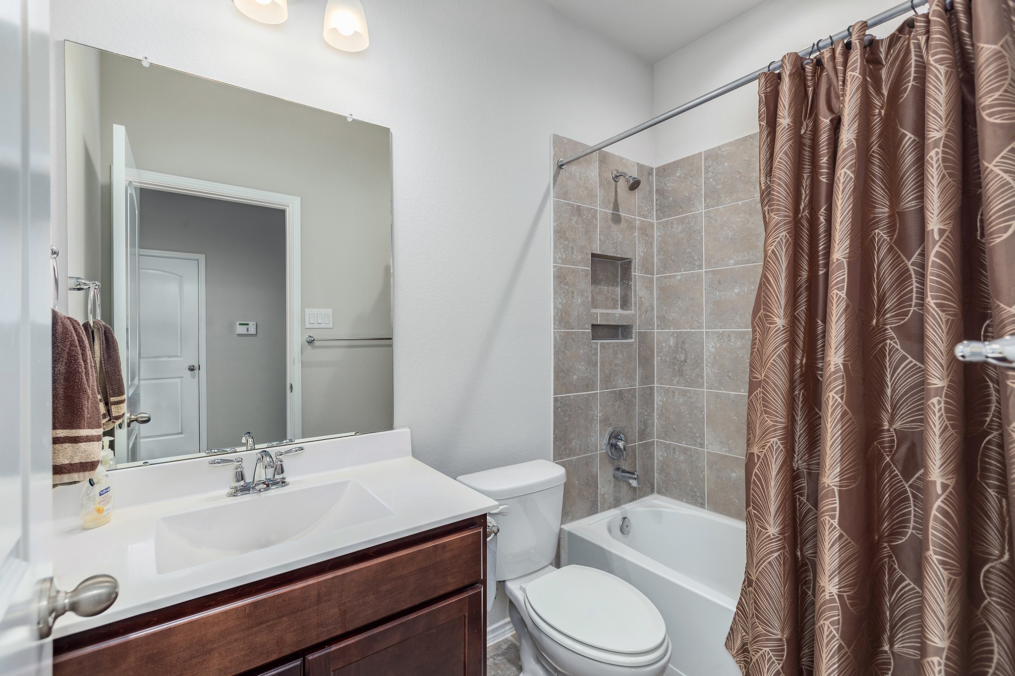 5611 Claymore Meadow Lane Spring, TX 77389 - Photo 22 of 32 a bathroom with a sink a toilet and shower