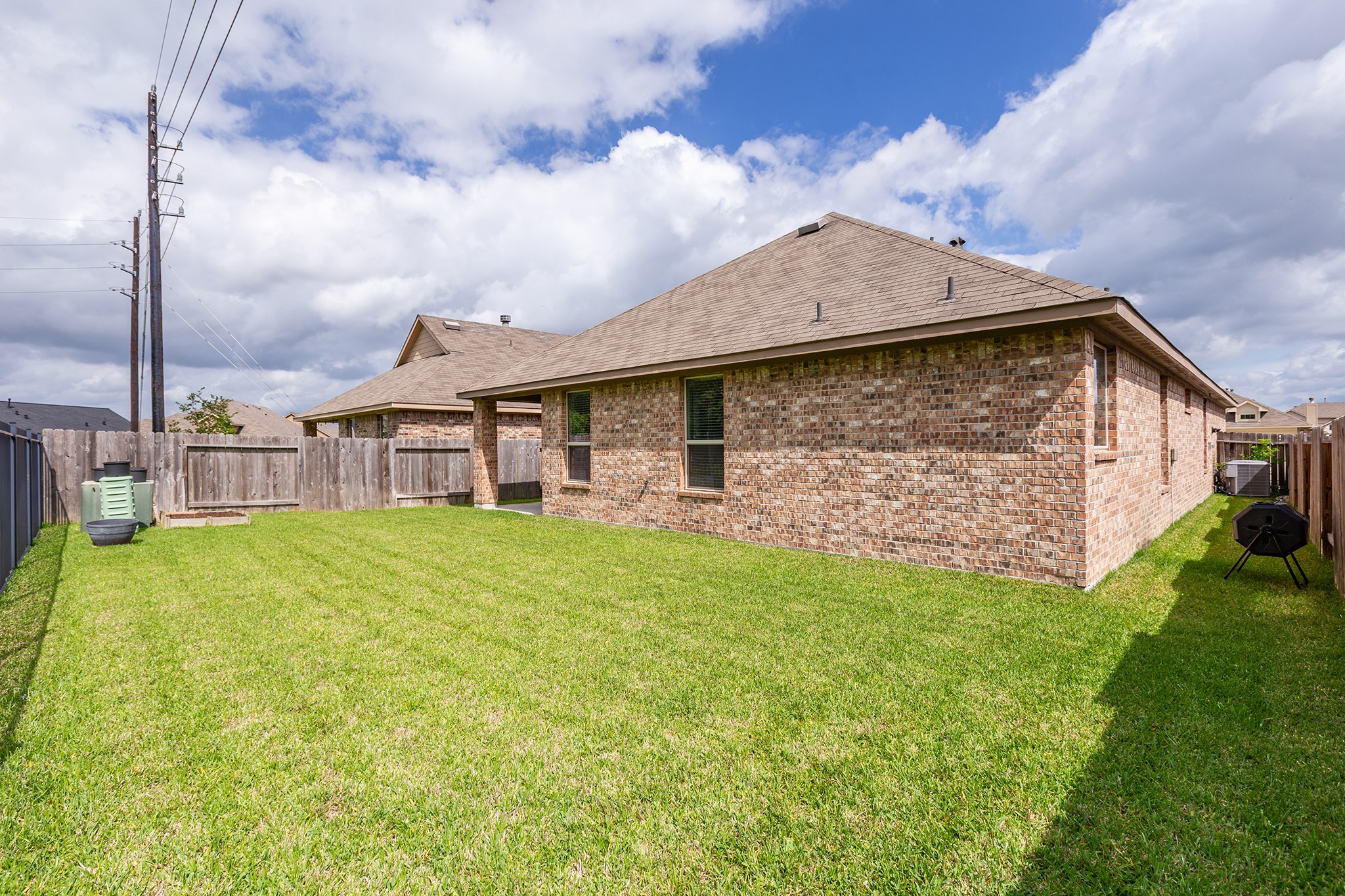 5611 Claymore Meadow Lane Spring, TX 77389 - Photo 29 of 32 a view of a house with backyard and porch