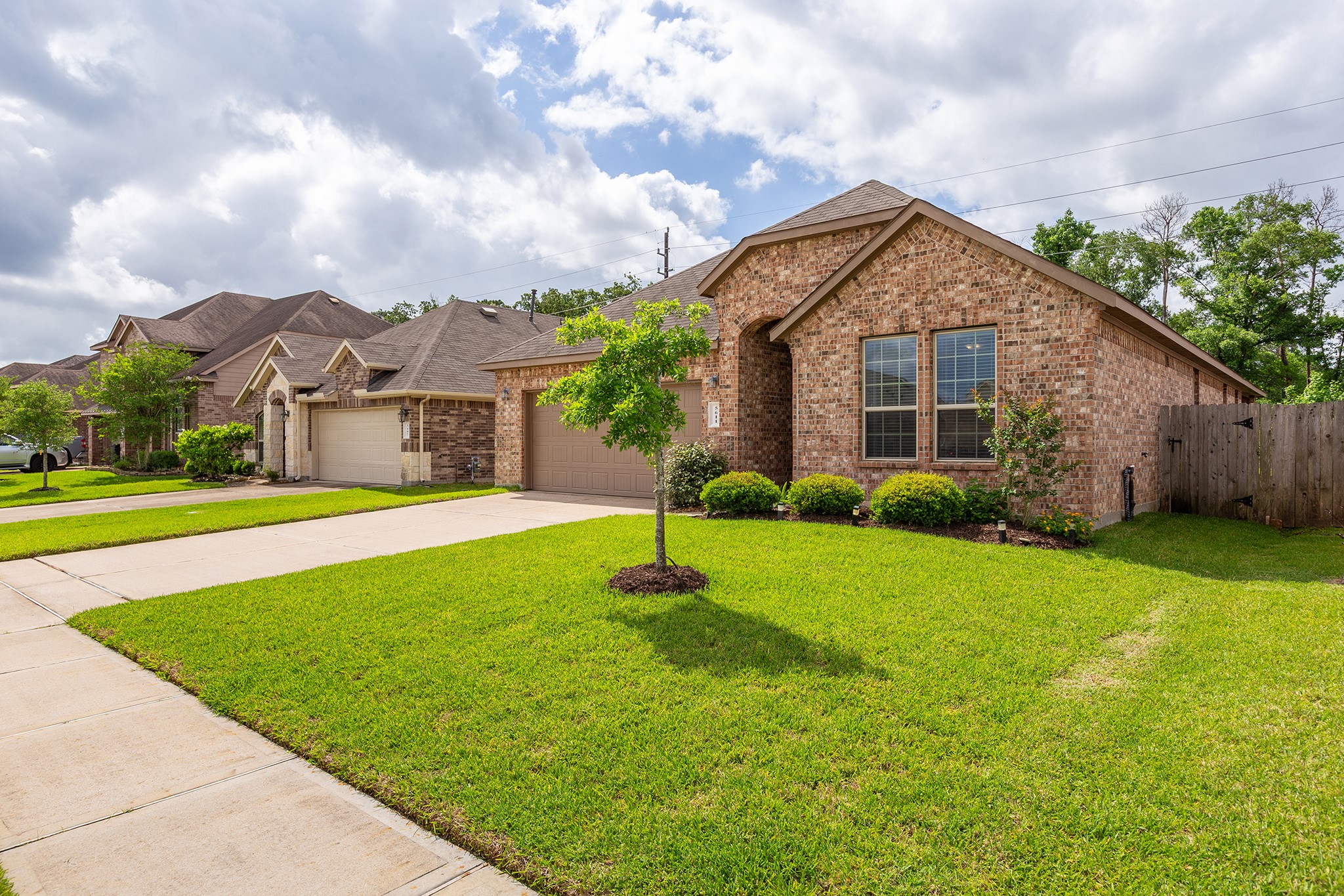 5611 Claymore Meadow Lane Spring, TX 77389 - Photo 30 of 32 a front view of house with yard and green space