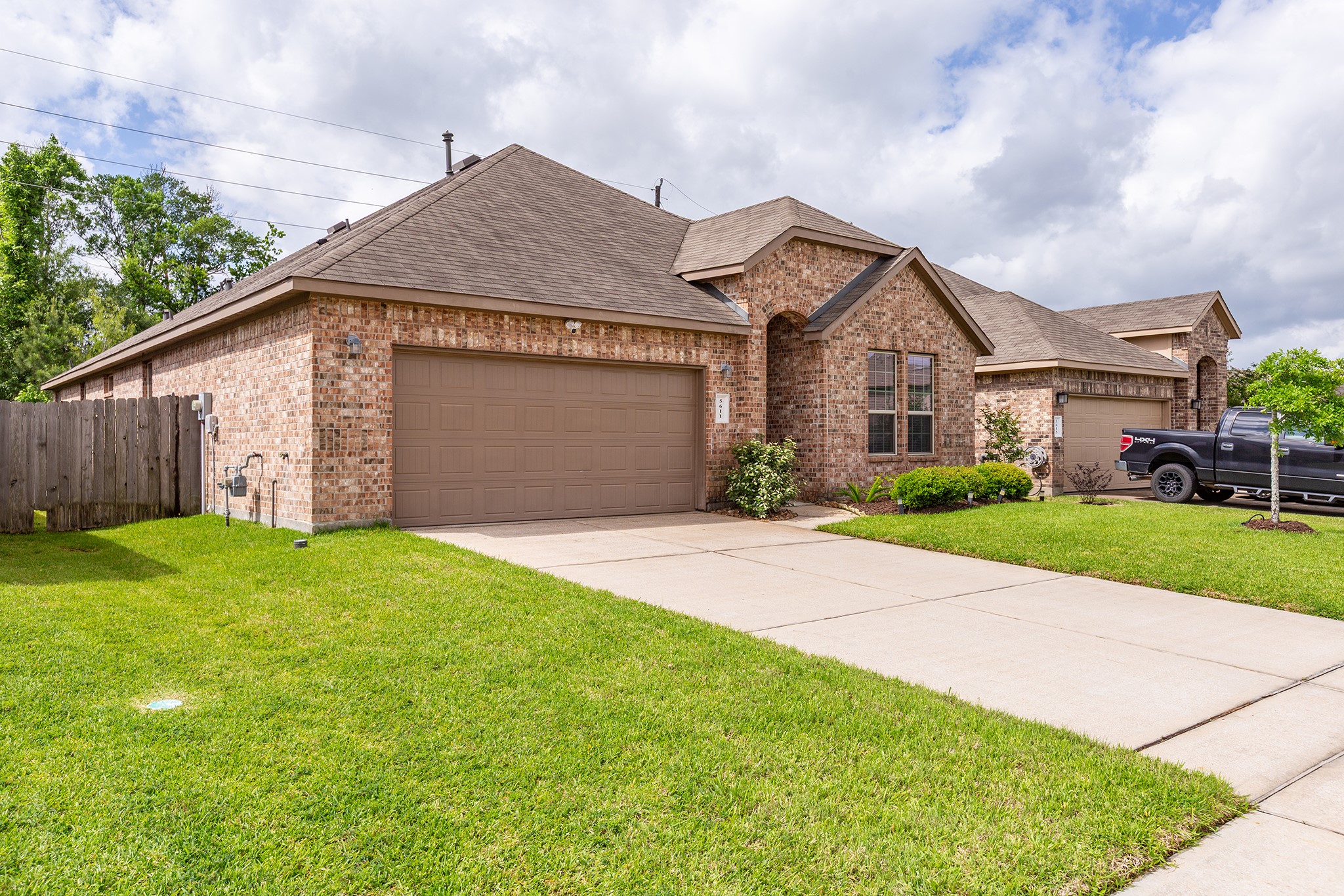 5611 Claymore Meadow Lane Spring, TX 77389 - Photo 31 of 32 a front view of house with yard and green space