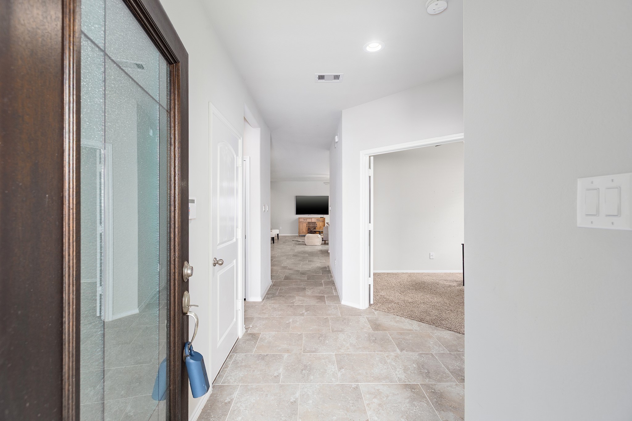 5611 Claymore Meadow Lane Spring, TX 77389 - Photo 3 of 32 Bright and airy entry with garage to the left, study and one full bath/bedroom to the right
