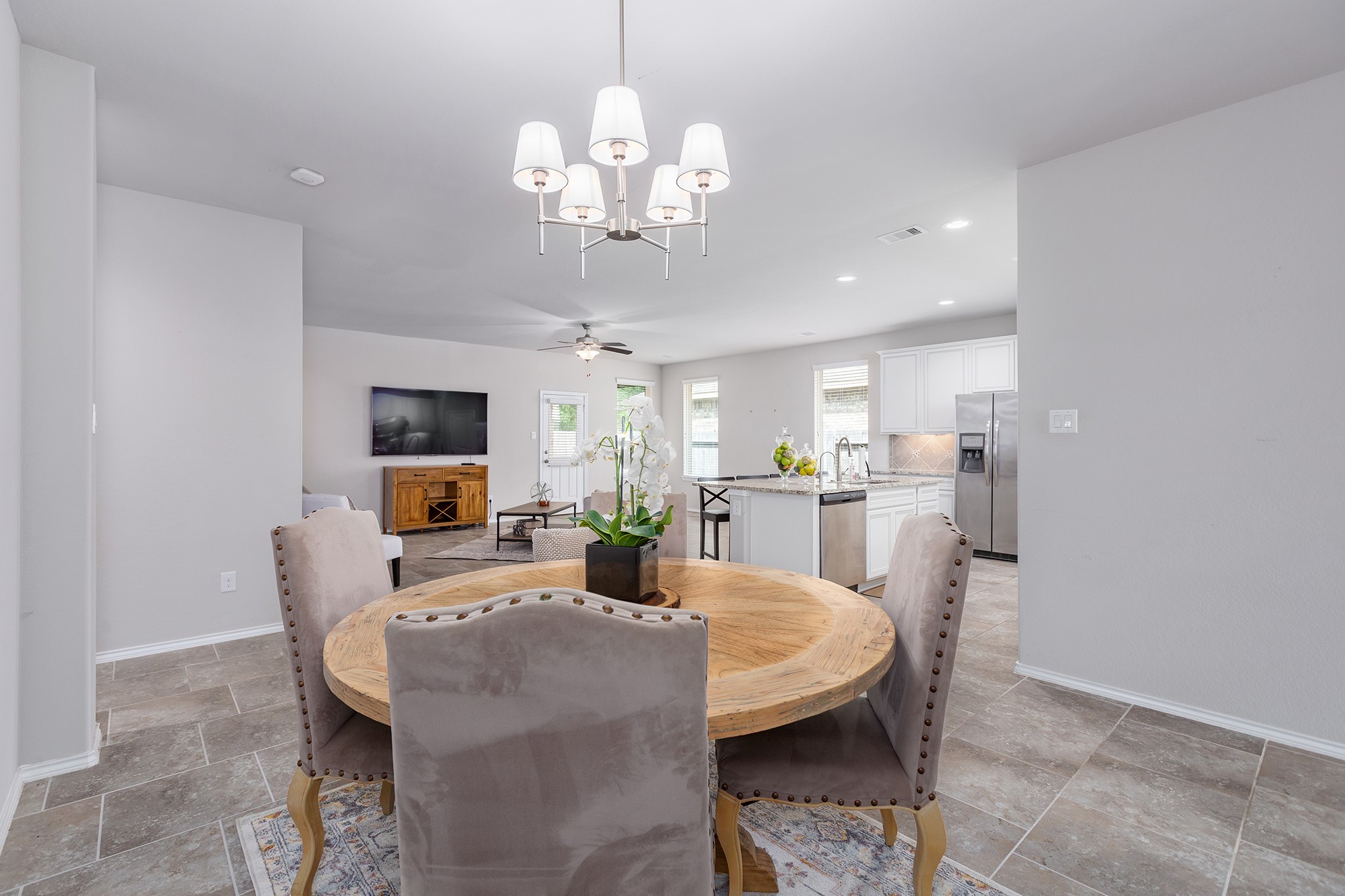 5611 Claymore Meadow Lane Spring, TX 77389 - Photo 7 of 32 a view of a dining room with furniture and a chandelier
