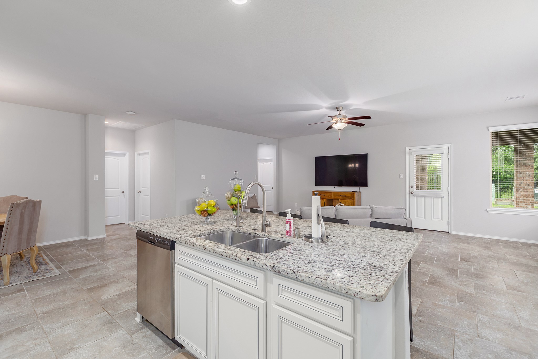 5611 Claymore Meadow Lane Spring, TX 77389 - Photo 9 of 32 a kitchen with stainless steel appliances granite countertop a sink and a granite counter tops