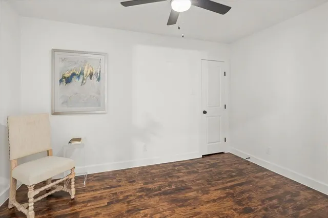 a view of room with painting on the wall