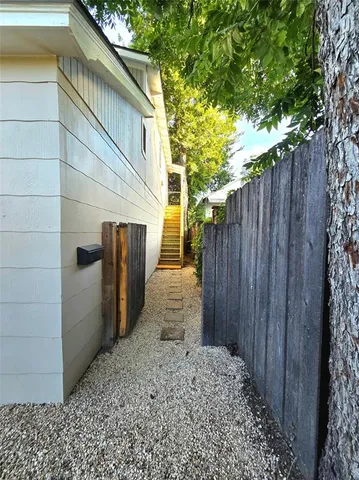 a backyard of a house with chairs