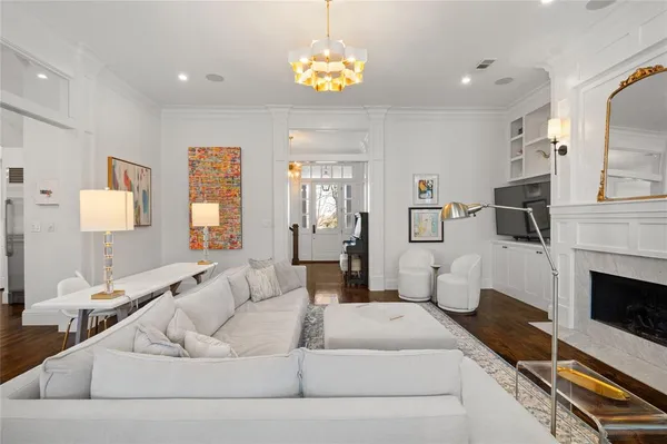 a living room with furniture and a fireplace