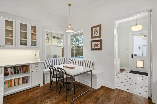 a view of a livingroom with furniture window and wooden floor