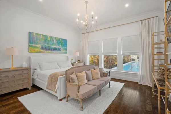 a bedroom with a large bed and a couch