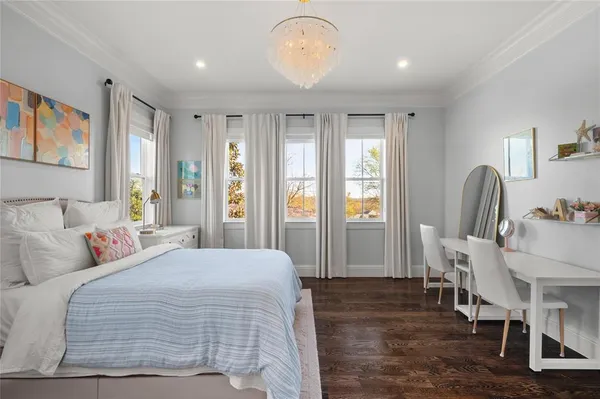 a bedroom with bed and window