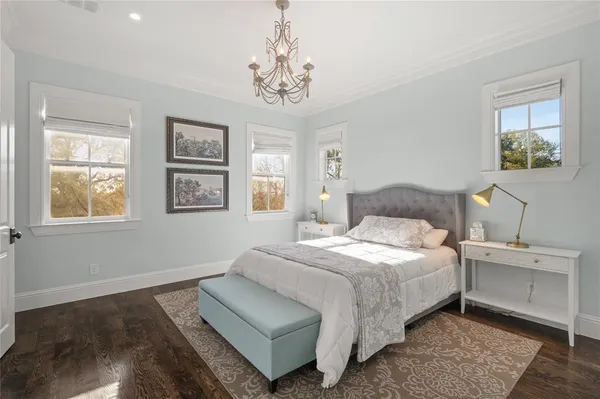 a bedroom with bed and window