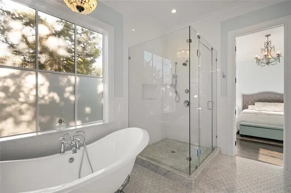 a bathroom with a tub and a shower
