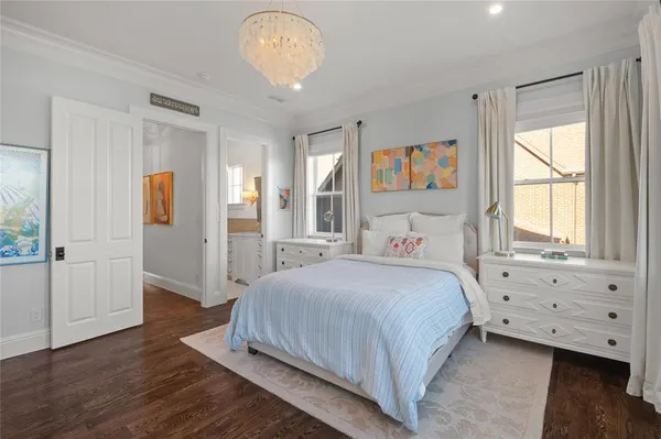 a bedroom with a large bed and a window