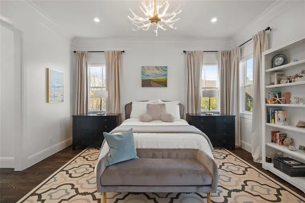 a bedroom with a bed furniture and a window