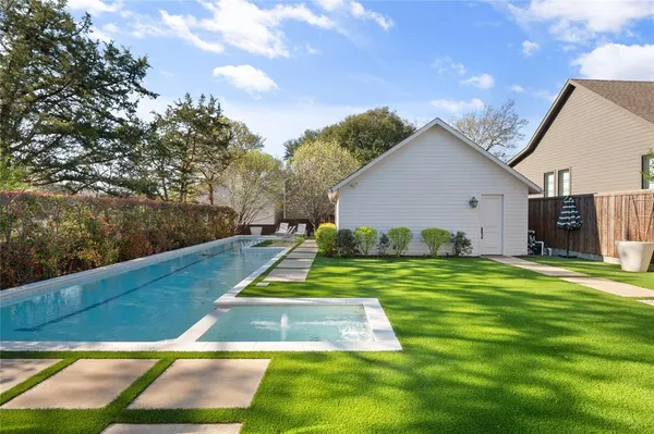 a view of a big yard with potted plants