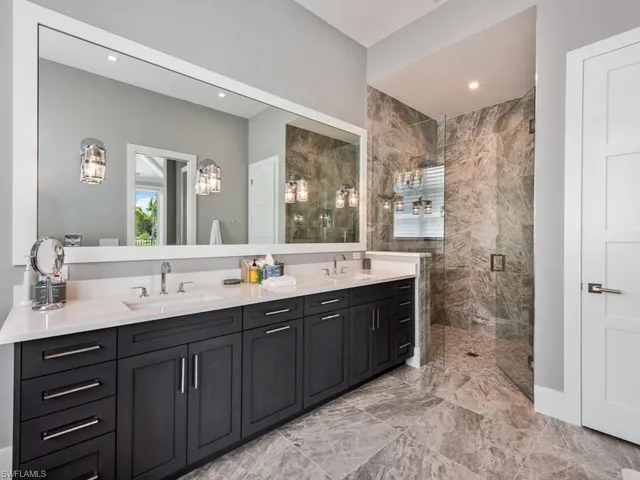 a bathroom with a double vanity sink mirror and double