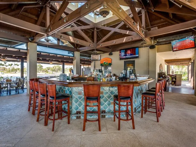 a view of a dining room with many windows