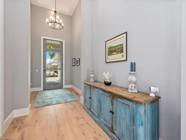 a spacious bathroom with a granite countertop sink a large mirror and shower