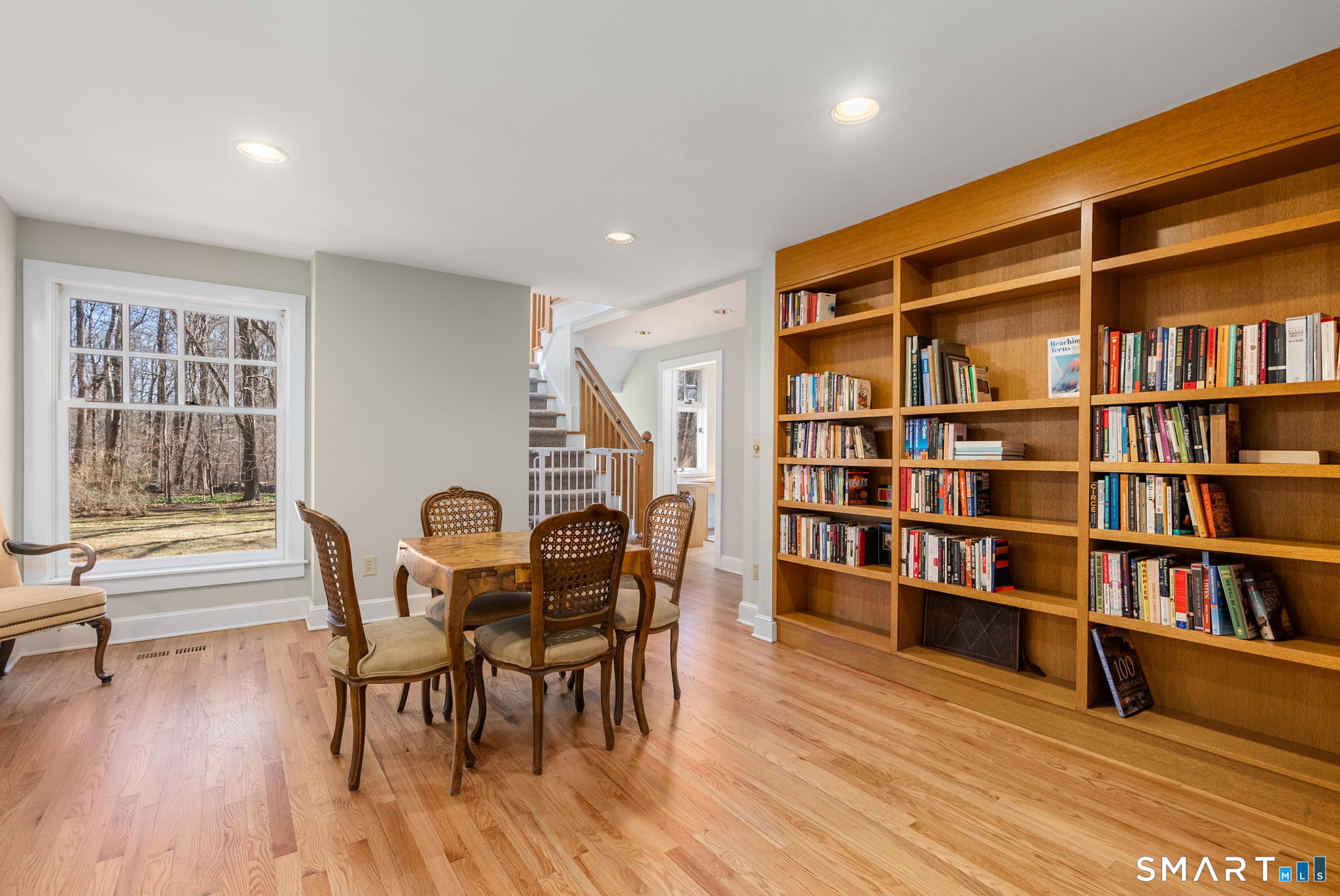 11 Highview Drive Woodbridge, CT 06525 - Photo 14 of 32 Charming library leading to a private office and upstairs to the primary suite.