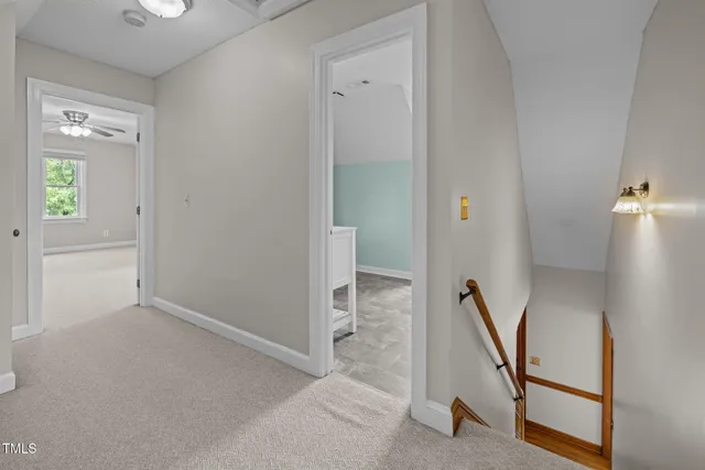 a view of a hallway with staircase