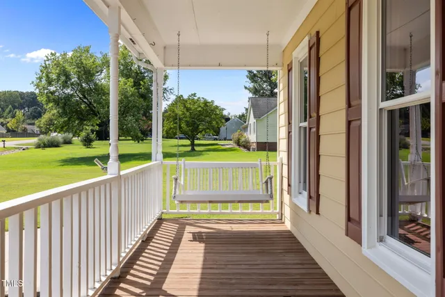 a view of outdoor space with deck and a garden