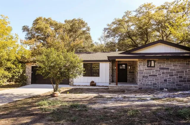 a view of a brick house with a large window