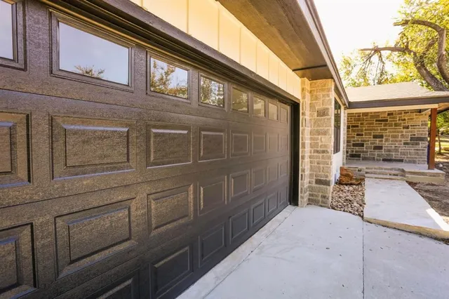 a view of a backyard with large trees