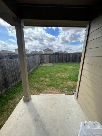 a view of a garden with sitting area
