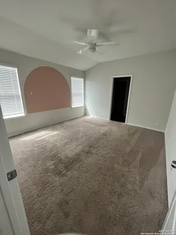 a view of an empty room with a fireplace