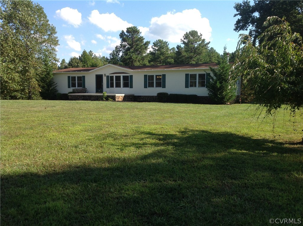 1038 Morning Star Road Appomattox, VA 24522 - Photo 2 of 22 a front view of a house with a garden