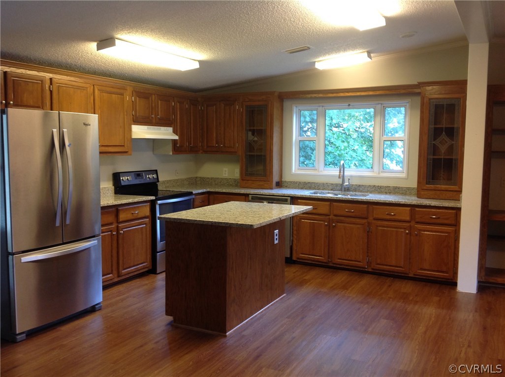 1038 Morning Star Road Appomattox, VA 24522 - Photo 3 of 22 a kitchen with wooden floors and stainless steel appliances