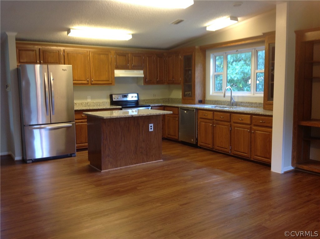 1038 Morning Star Road Appomattox, VA 24522 - Photo 4 of 22 a kitchen with stainless steel appliances granite countertop a refrigerator a sink dishwasher a stove a refrigerator and cabinets with wooden floor