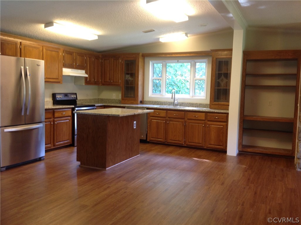 1038 Morning Star Road Appomattox, VA 24522 - Photo 5 of 22 a large kitchen with wooden floors and stainless steel appliances