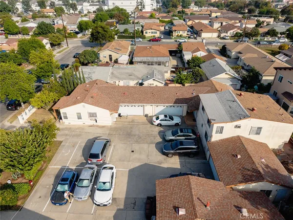 an aerial view of residential houses with outdoor space