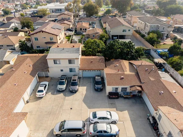 an aerial view of residential houses with outdoor space