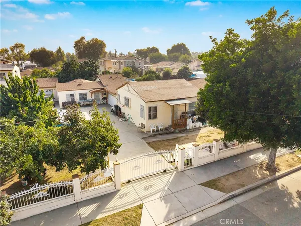 an aerial view of a house with a yard