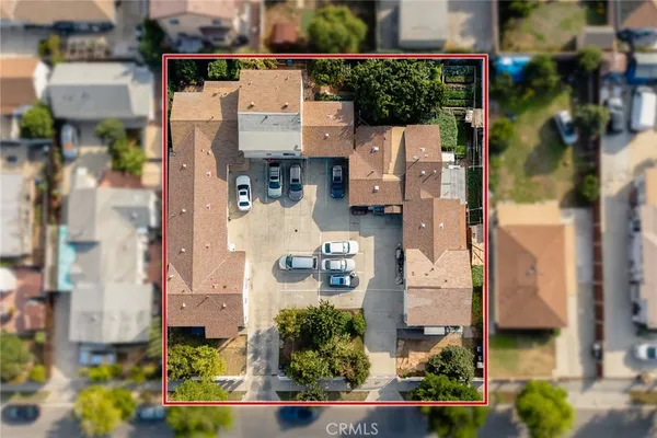 an aerial view of residential houses with outdoor space