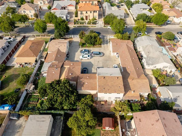 an aerial view of residential houses with outdoor space