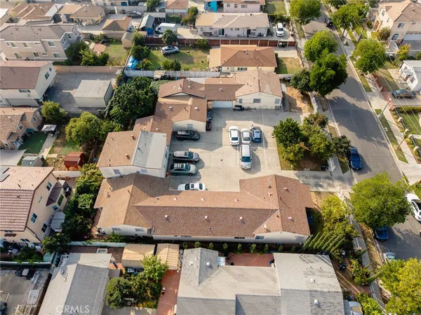 an aerial view of residential houses with outdoor space