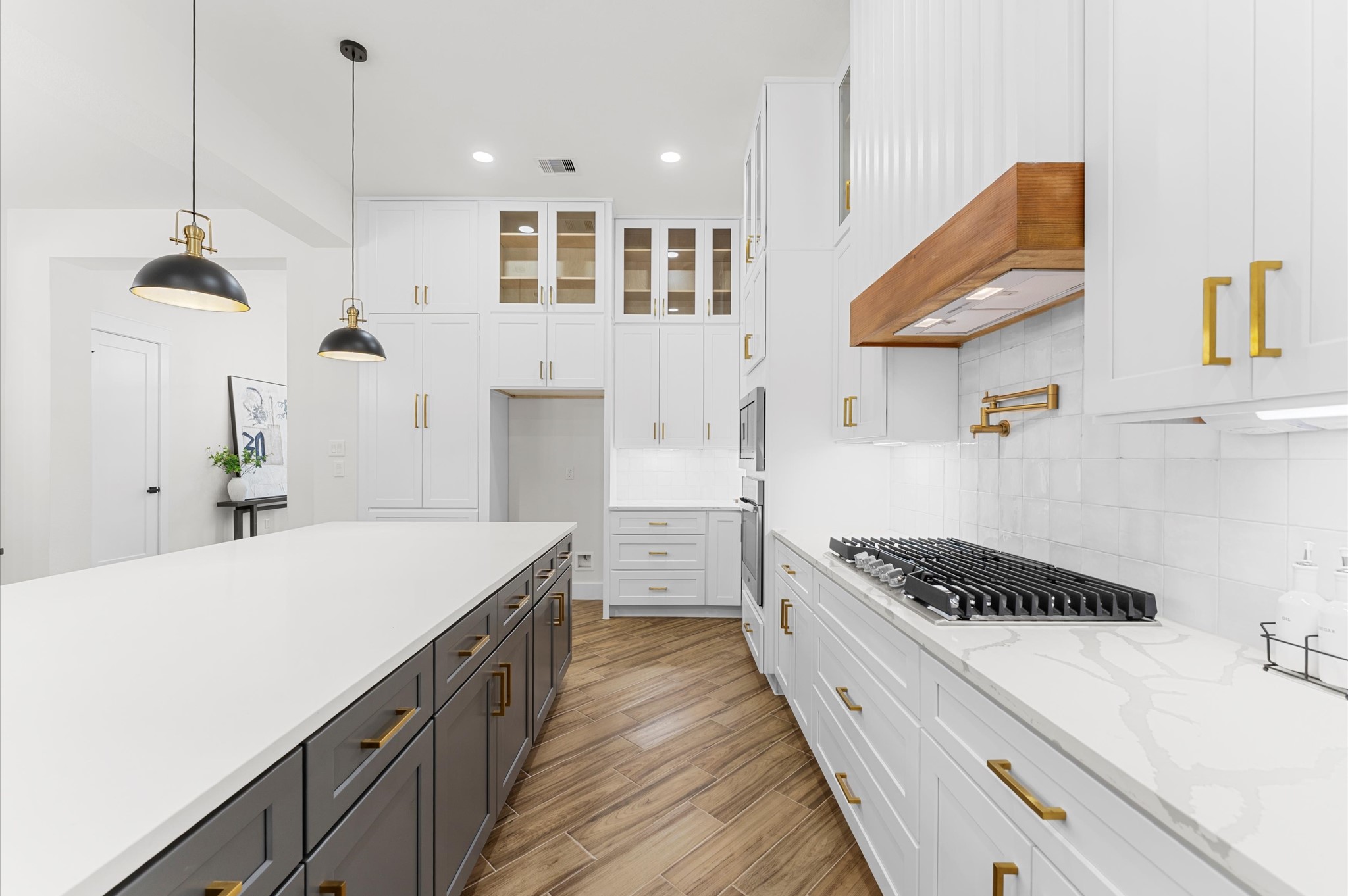 118 Ranger Road Huntsville, TX 77340 - Photo 17 of 49 a kitchen with kitchen island stainless steel appliances a stove a sink a refrigerator and a wooden floor